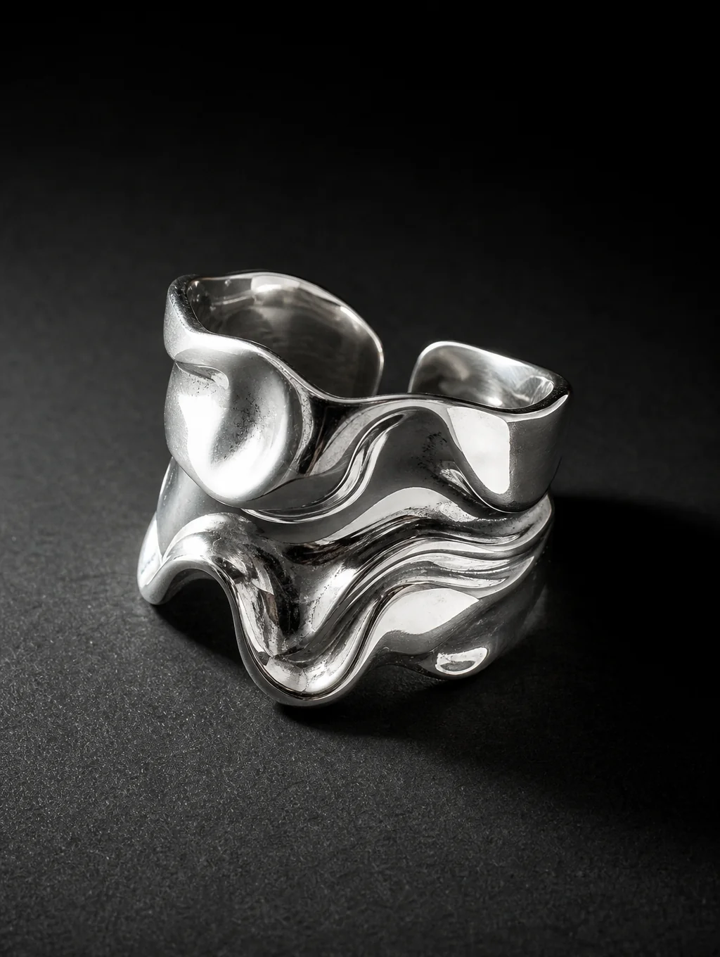 Handcrafted solid sterling silver jewelry catching directional studio light